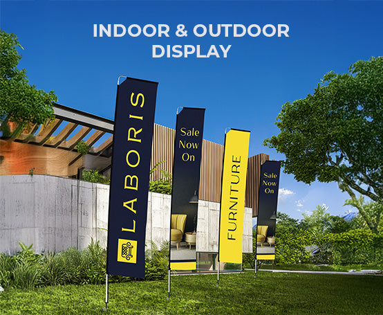 Laboris outdoor display banners in an outdoor setting with trees and a building.